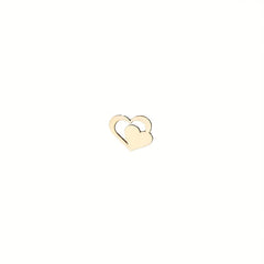 Gold heart-shaped earring on a white background