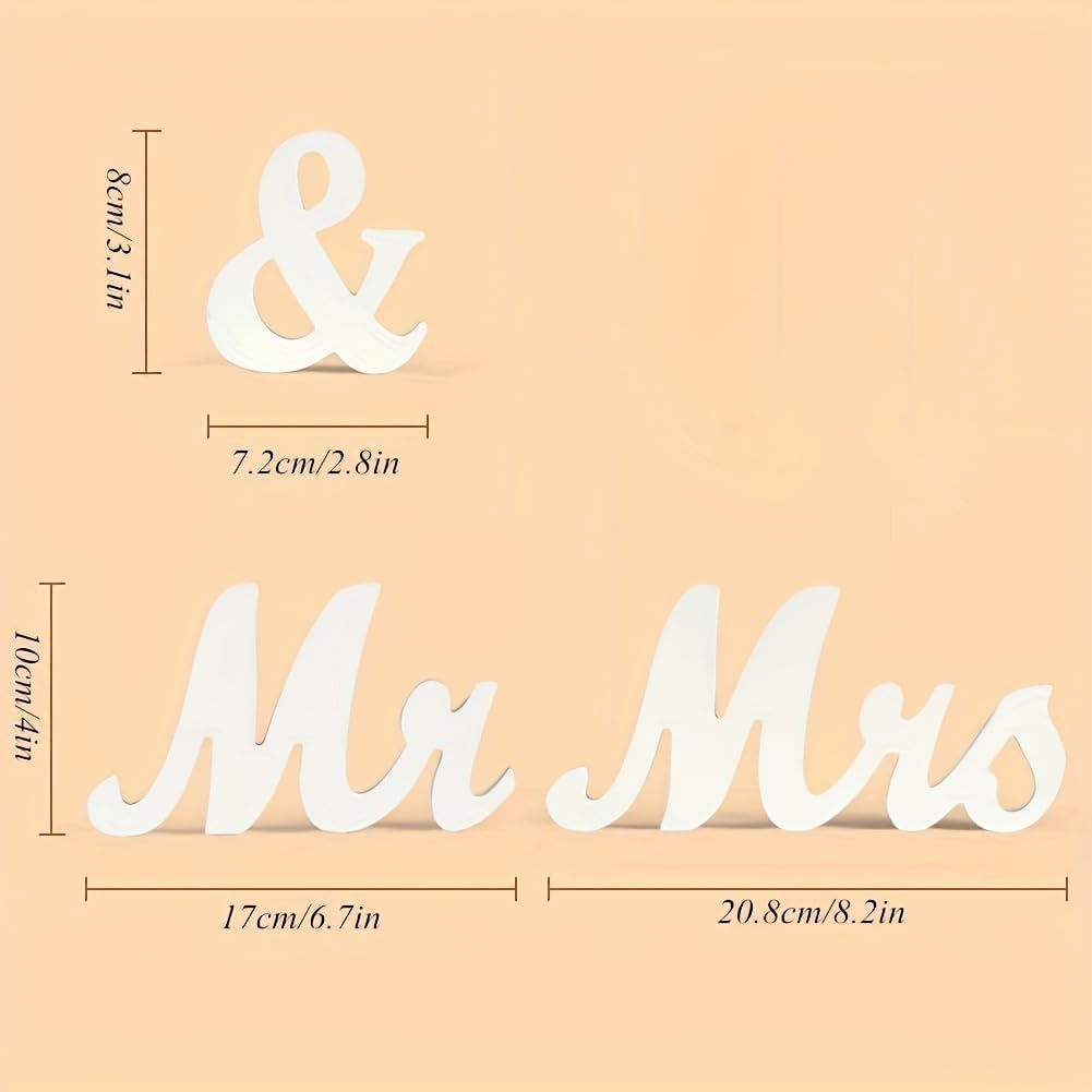 Decorative signs with 'Mr & Mrs' on a beige background
