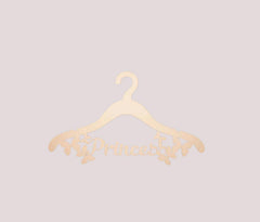 Gold hanger with 'Princess' text on a light gray background
