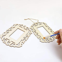 Decorative wooden frames with intricate cut-out designs on a white background.