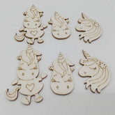 Set of wooden unicorn shapes on a white background