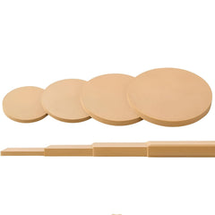 Set of beige makeup pads with a stick on a white background