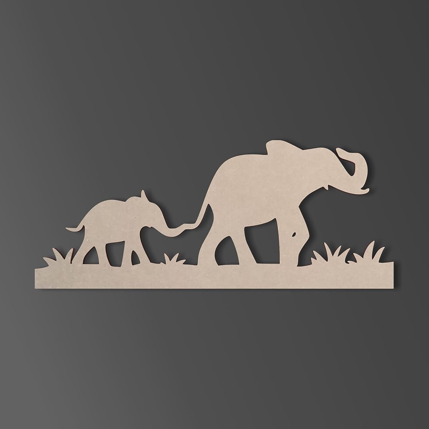 Wooden cutout of two elephants on a dark gray background