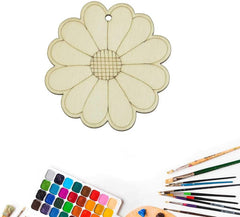 Flower-shaped art template with watercolor set and brushes on a white background