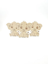 Three wooden elephant figures on a white background