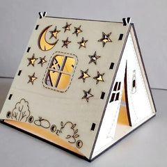 Wooden children's teepee with star and moon designs on a gray background