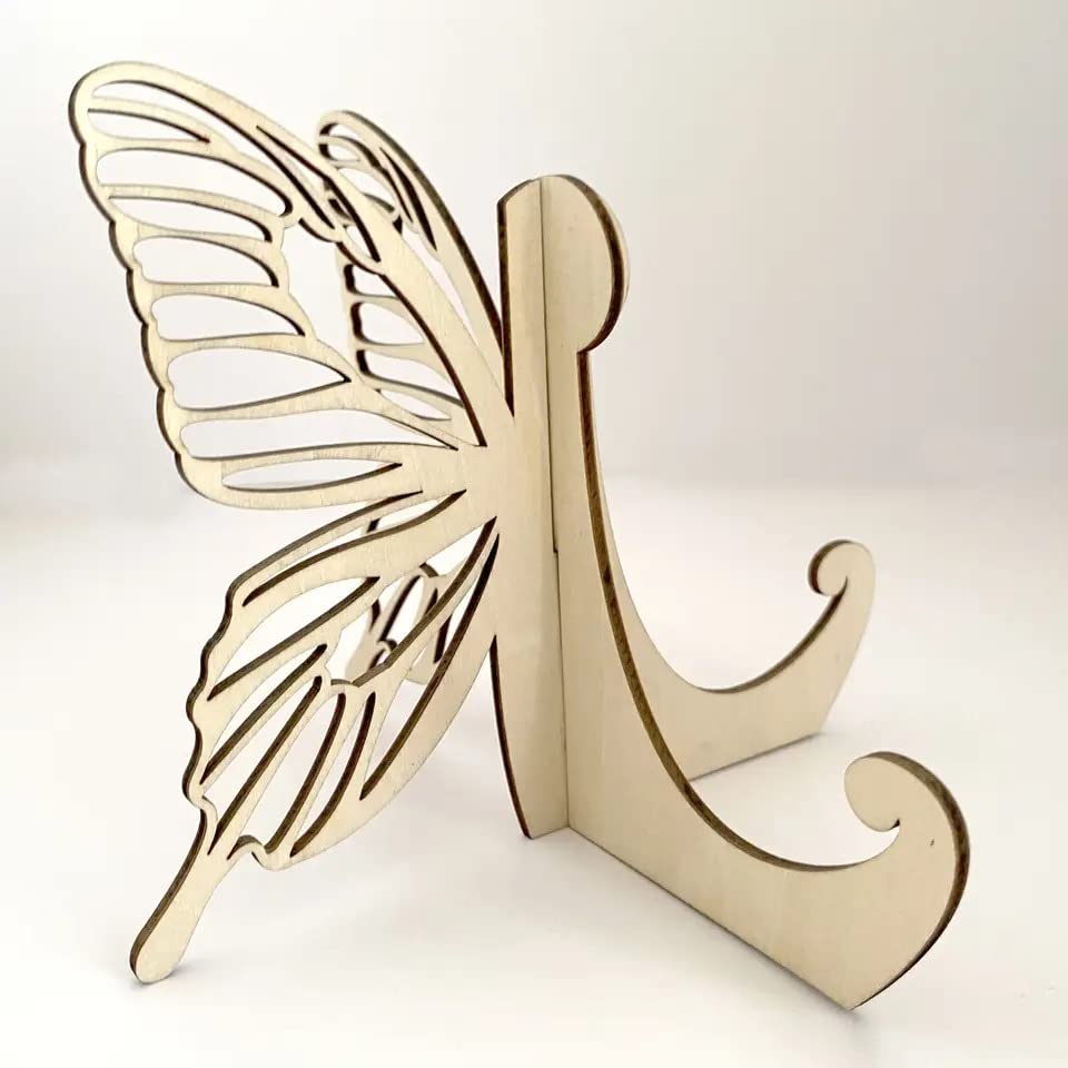 Wooden letter 'K' with butterfly wings on a white background