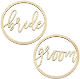 Two gold circular signs with 'bride' and 'groom' text on a white background