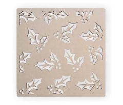 Decorative stencil with holly leaf patterns on a beige background