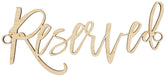 Wooden 'Reserved' sign with cursive lettering on a plain background