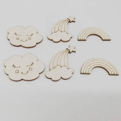 Wooden cutouts of clouds and rainbows on a light gray background