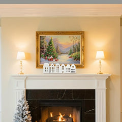 Festive fireplace with Christmas decorations, including a tree and framed artwork.