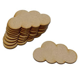 Stack of cloud-shaped wooden cutouts on a white background