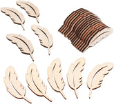 Wooden feather shapes and a roll of brown ribbon on a white background