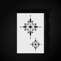 Decorative stencil with floral patterns on a black background