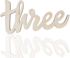 Wooden number 'three' on a white background