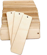 Stack of wooden name tags with holes for punching on a white background
