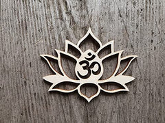 Wooden lotus flower with Om symbol on a wooden background