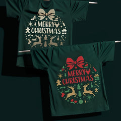 Two green t-shirts with 'Merry Christmas' designs on a dark background