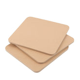 Two beige square coasters stacked on a white background