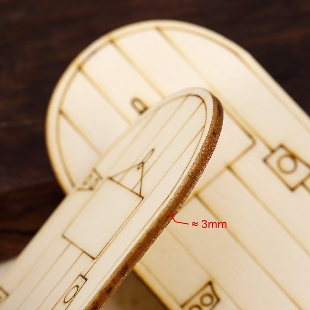 Close-up of a laser-cut wooden model airplane with dimensions indicated.