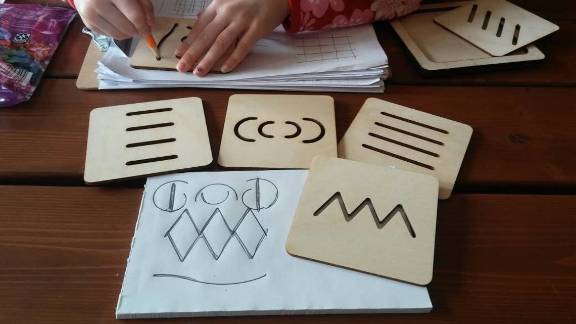Wooden educational cards with symbols on a wooden surface