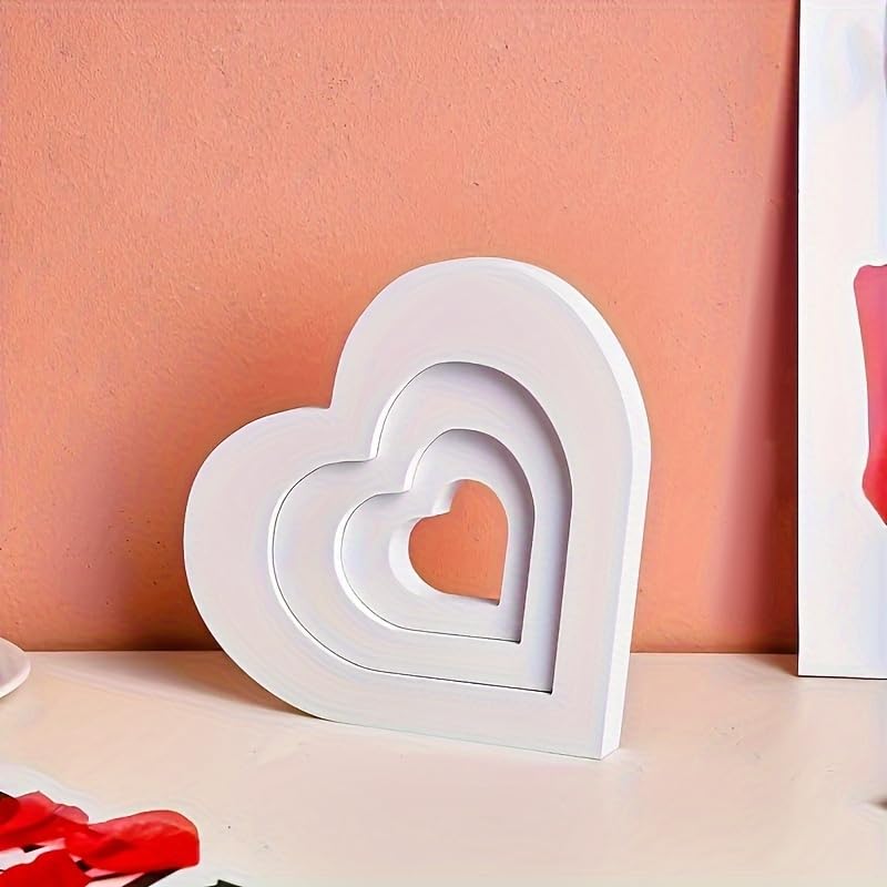 Stack of white heart-shaped objects on a peach-colored background