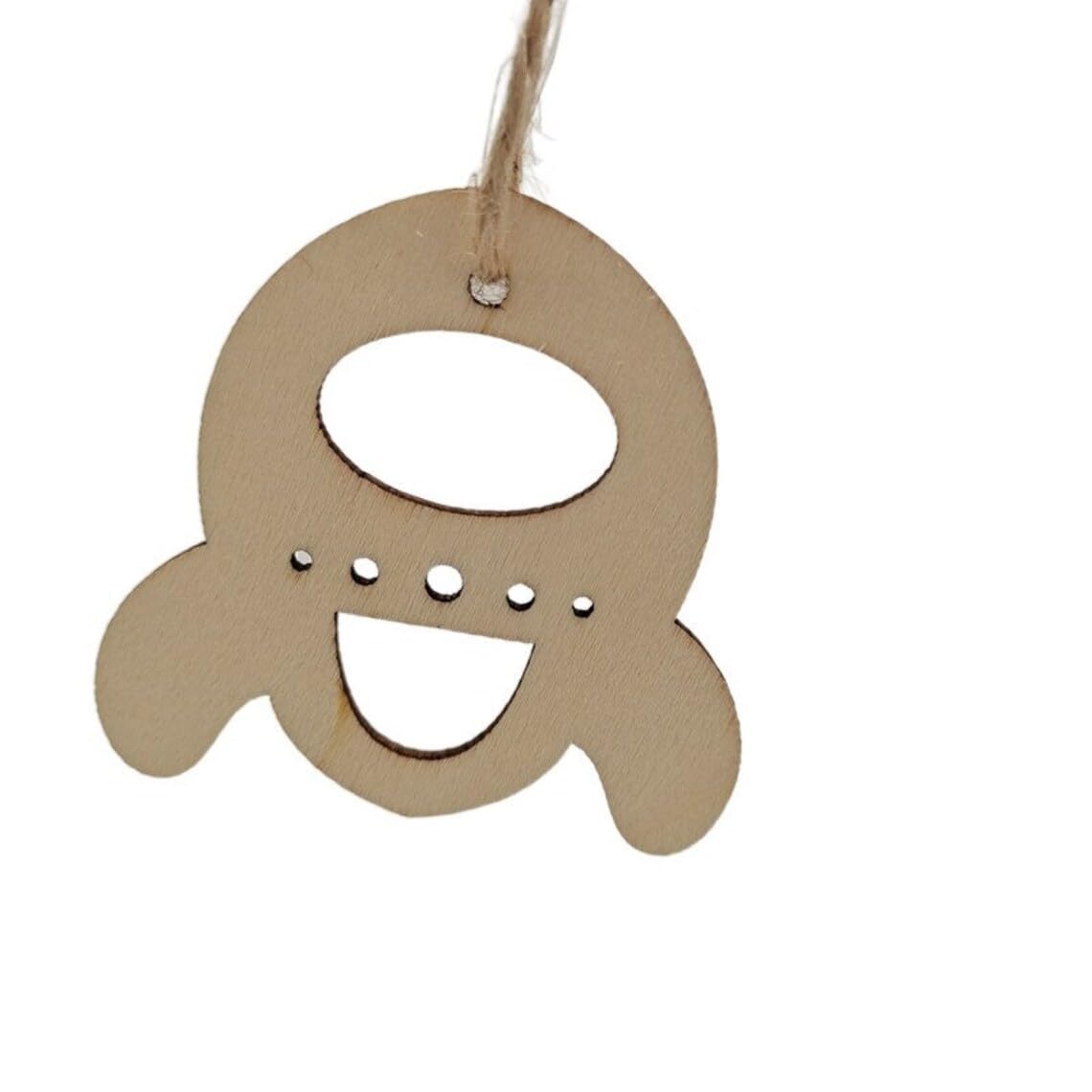 Brown paper cutout of a letter 'Q' with a string on a white background
