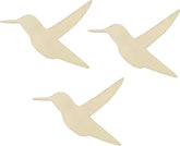 Three beige bird-shaped decorations on a white background