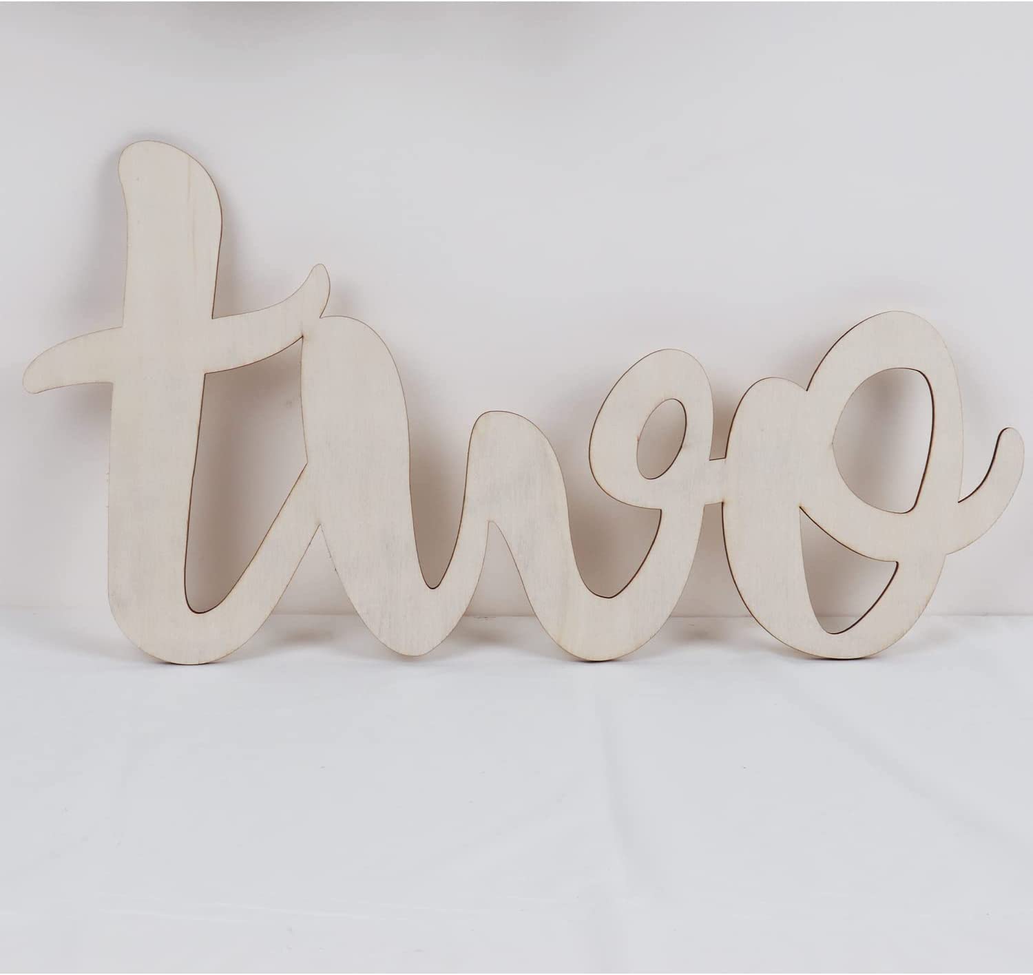 Wooden number 'two' on a white background