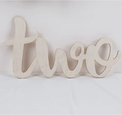 Wooden number 'two' on a white background