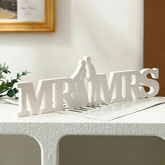 Decorative sign with 'MR & MRS' on a table