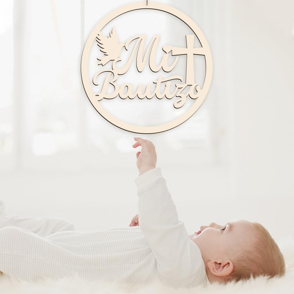 Baby reaching towards a decorative wooden sign with 'Mia Lautz' on a white background
