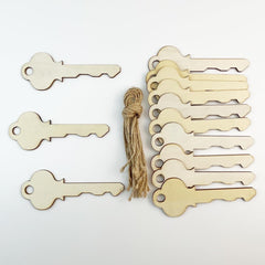 Set of wooden keys with a tassel on a white background
