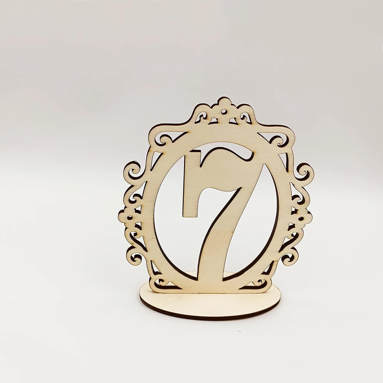 Wooden number '7' with decorative frame on a white background