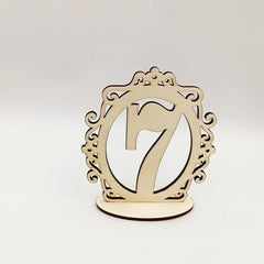 Wooden number '7' with decorative frame on a white background