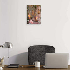 Laptop on a desk with a decorative wall art piece above it