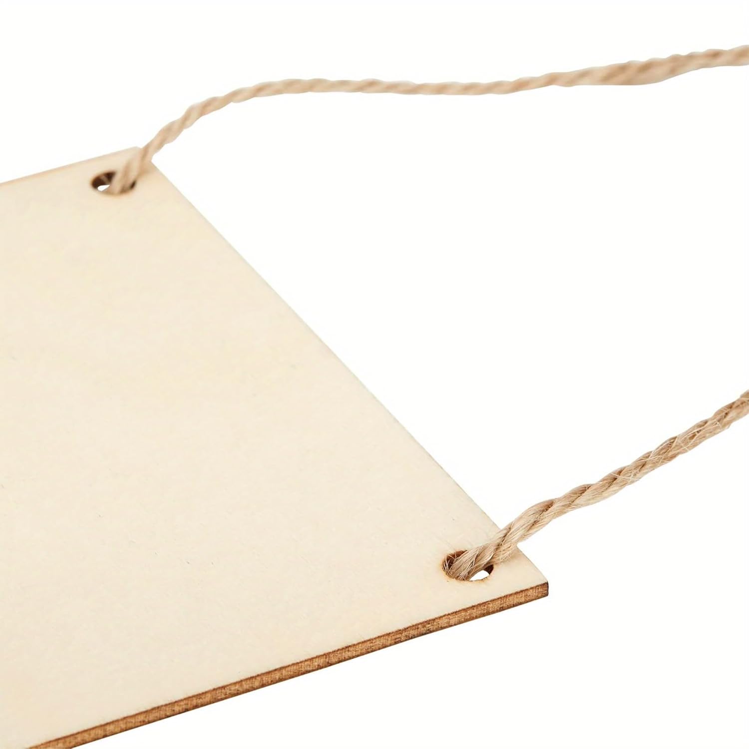 Beige paper tag with string on a white background