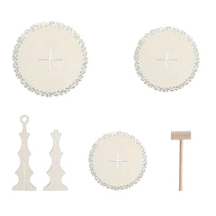 Set of decorative items including round plates with cross symbols and standing stands on a white background