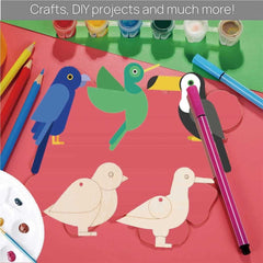 Colorful bird-shaped craft items on a red surface with art supplies.