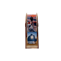 Wooden photo display with three images of a couple at sunset.