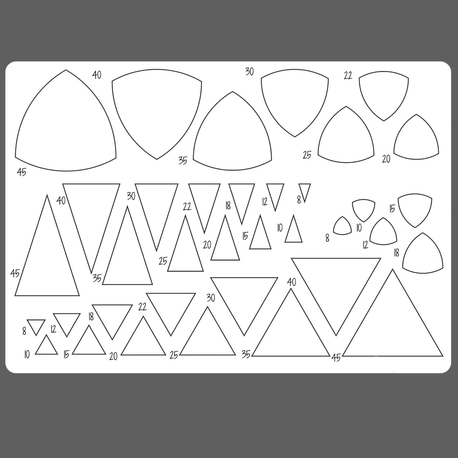 Set of geometric templates with various shapes and measurements on a gray background