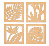 Four cork coasters with leaf cutouts on a white background