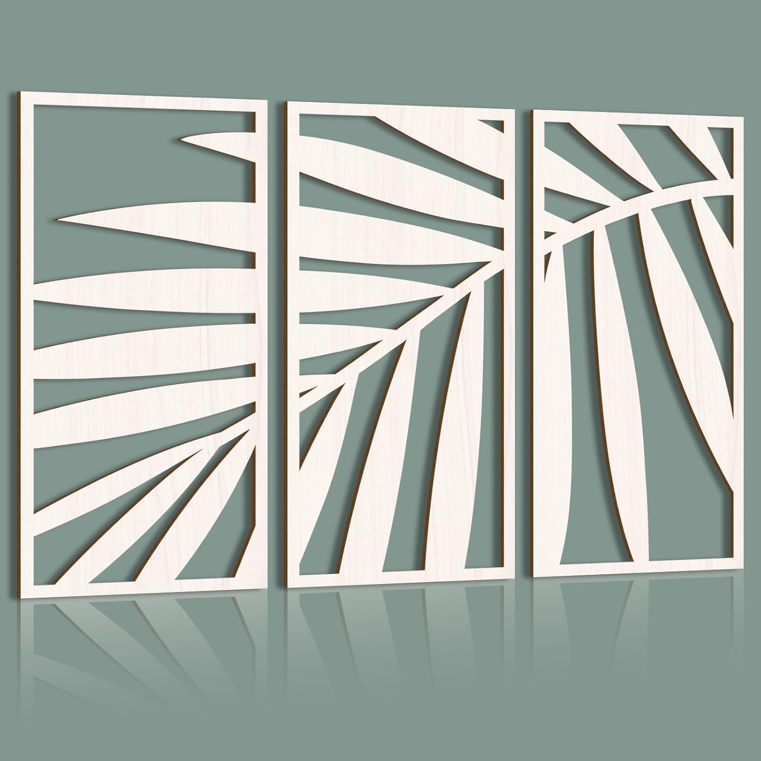Three white abstract leaf-patterned panels on a gray background