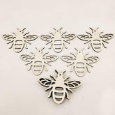 Wooden bee shapes on a white background
