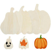 Set of wooden pumpkin-shaped cutouts with a small pumpkin and leaf cutout on a white background