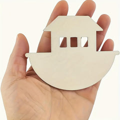 Hand holding a small wooden boat-shaped object against a white background