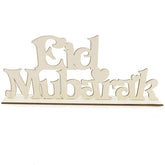 Wooden 'Eid Mubarak' sign on a white background