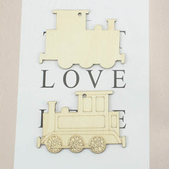 Wooden train-shaped cutout with 'LOVE' text on a light background