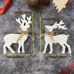 White reindeer ornaments with brown bows and measurements on a gray surface